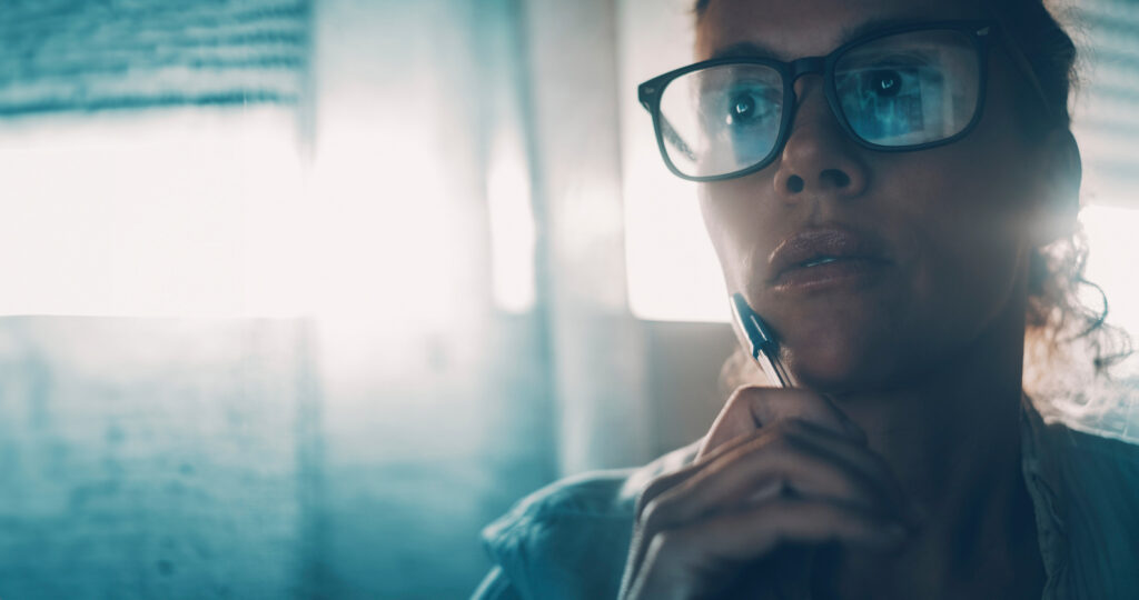 Businesswoman thinking and looking at online content audit