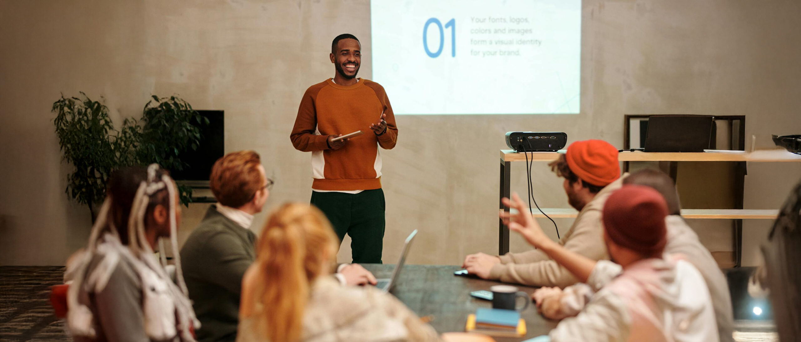 Inclusive. Man presenting on how to get inclusive marketing right, to an audience