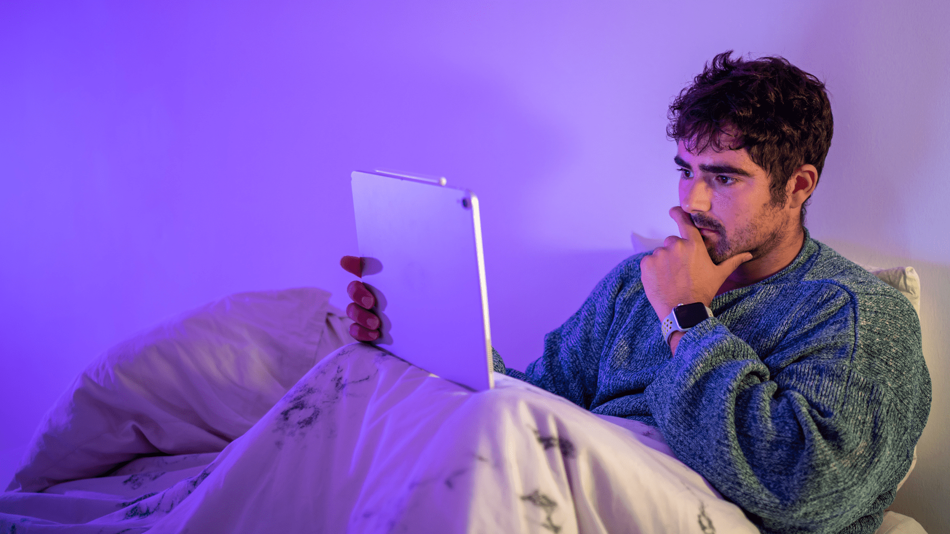 Man choosing between watching video or reading copy
